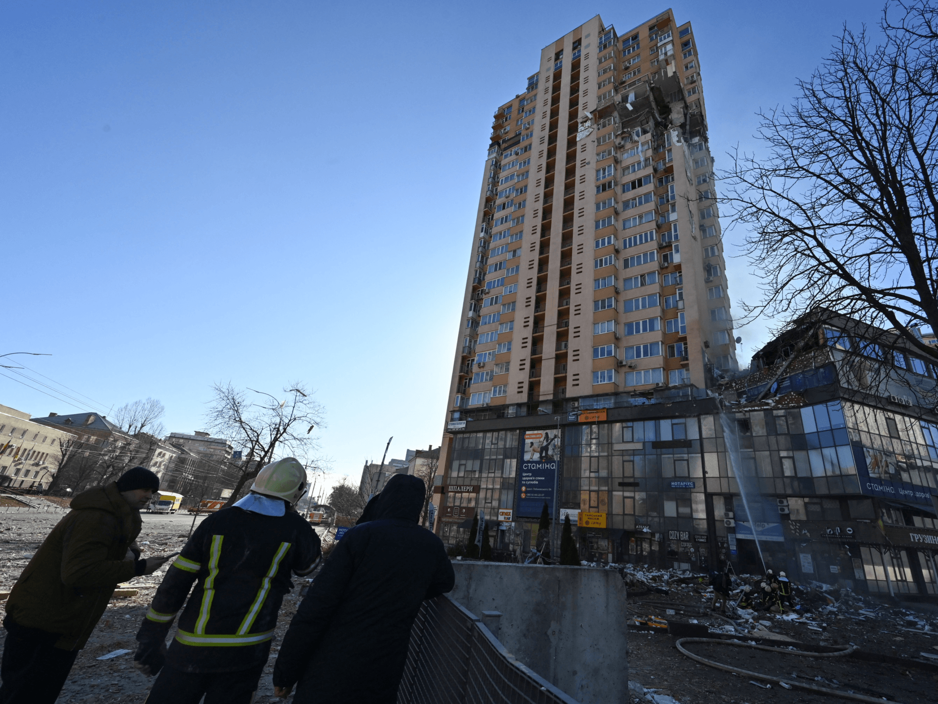 Firefighters extinguish fire in a high-rise apartment block which was hit by recent shelling in Kyiv on February 26, 2022. - Ukrainian soldiers repulsed a Russian attack in the capital, the military said on February 26 after a defiant President Volodymyr Zelensky vowed his pro-Western country would not be bowed by Moscow. It started the third day since Russian leader Vladimir Putin unleashed a full-scale invasion that has killed dozens of people, forced more than 50,000 to flee Ukraine in just 48 hours and sparked fears of a wider conflict in Europe. (Photo by GENYA SAVILOV / AFP) (Photo by GENYA SAVILOV/AFP via Getty Images)