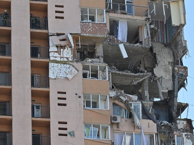A view of a high-rise apartment block which was hit by recent shelling in Kyiv on February