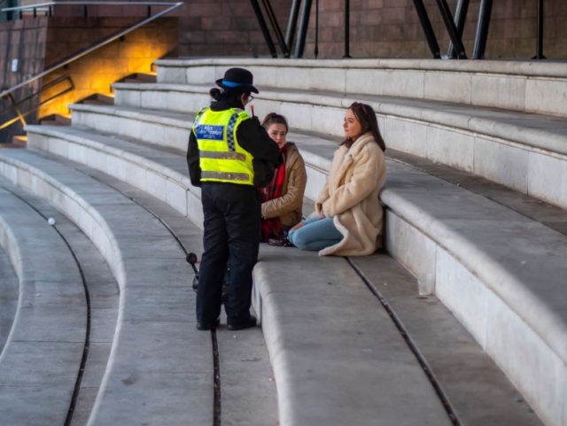 MANCHESTER, ENGLAND - APRIL 12: A Police officers speak to two women in Castlefield Bowl o