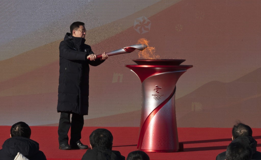 BEIJING, CHINA - FEBRUARY 2: China's Vice Premier Han Zheng lights the torch during the launch ceremony for the Beijing 2022 Winter Olympics Torch Relay in front of the Olympic Tower outside of the closed loop bubble on February 2, 2022 at Olympic Park in Beijing, China. The games are set to open on February 4th. (Photo by Kevin Frayer/Getty Images)