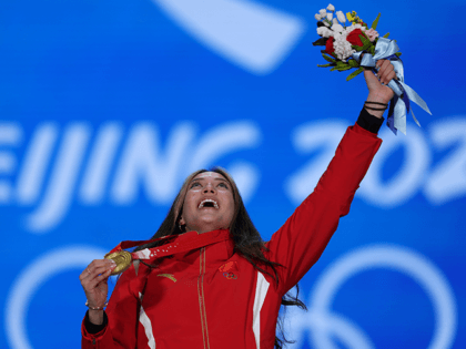 Gold medallist Ailing Eileen Gu of Team China celebrates with their medal during the Women