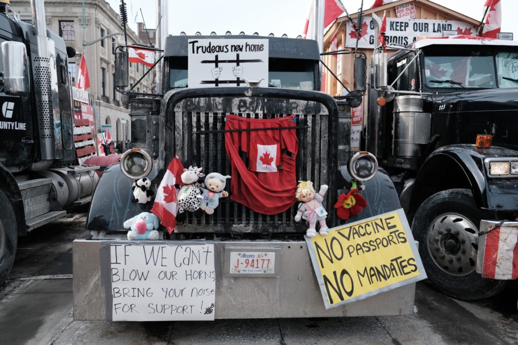 OTTAWA, ONTARIO - FEBRUARY 09: Hundreds of truck drivers and their supporters block the streets of downtown Ottawa as part of a convoy of protesters against COVID-19 mandates in Canada on February 09, 2022 in Ottawa, Ontario. The protesters, whose goals and demands have shifted as more conservative and right-wing groups become involved, are entering their 13th day of blockading the area around the Parliament building. Over 400 vehicles have now joined the convoy which has forced businesses to close and unnerved residents. A state of emergency has been called in Ottawa as police and local officials decide on how best to bring the event to an end. (Photo by Spencer Platt/Getty Images)