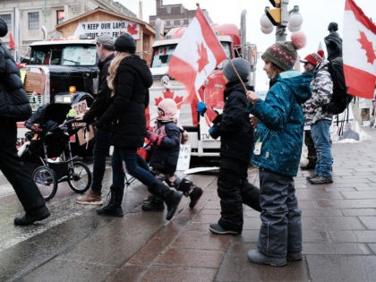 OTTAWA, ONTARIO - FEBRUARY 10: Hundreds of truck drivers and their supporters, including children, gather to block the streets of downtown Ottawa as part of a convoy of truck protesters against Covid mandates in Canada on February 10, 2022 in Ottawa, Ontario. The protesters, whose goals and demands have shifted …