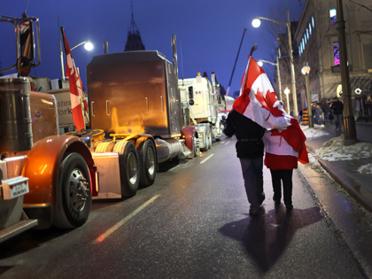 Protestors participate in a blockade of downtown streets near the parliament building as a