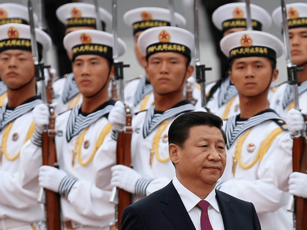 BEIJING, CHINA - SEPTEMBER 16: Chinese People's Liberation Army navy soldiers of a guard of honor look at Chinese President Xi Jinping (Front) during a welcoming ceremony for King Hamad Bin Isa Al Khalifa of Bahrain outside the Great Hall of People on September 16, 2013 in Beijing, China. At the invitation of Chinese President Xi Jinping, King Hamad Bin Isa Al Khalifa of Bahrain paid a state visit to China from September 14 to 16. (Photo by Feng Li/Getty Images)