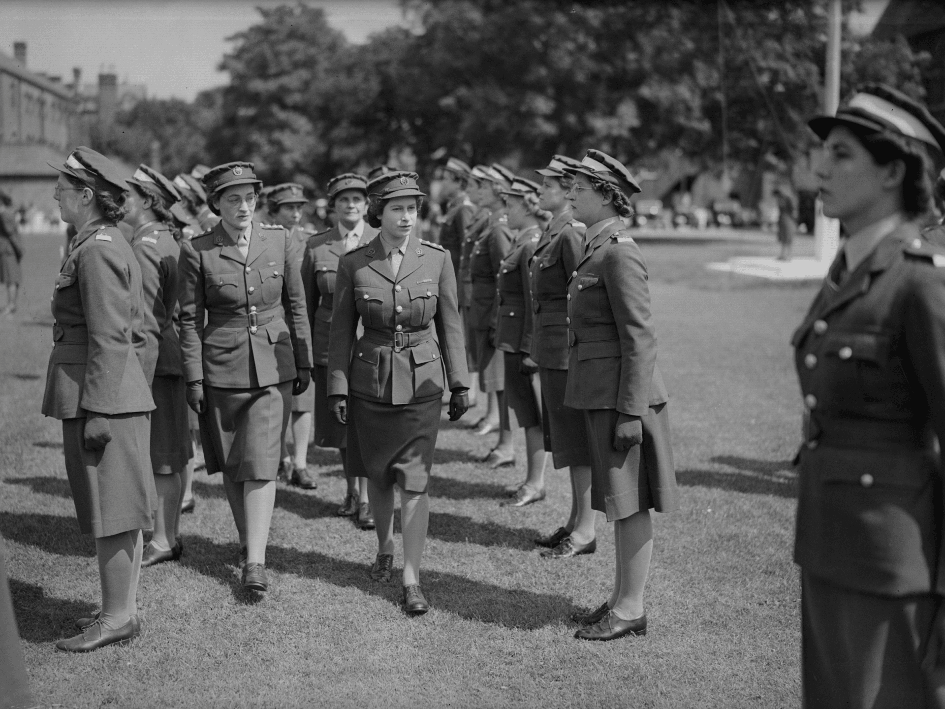 13th June 1946: Princess Elizabeth inspecting ATS (Auxiliary Territorial Service) cadets at a passing out parade at Imperial Services College, Windsor, England. (Photo by Fox Photos/Getty Images)