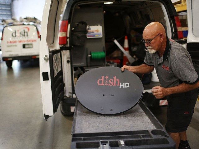 Alberto Rodriguez a Dish Network technician restocks his truck on June 4, 2015 in Miami, Florida. Reports indicate that Dish Network, the satellite television company , is in talks to acquire the wireless provider T-Mobile US. (Photo by Joe Raedle/Getty Images)