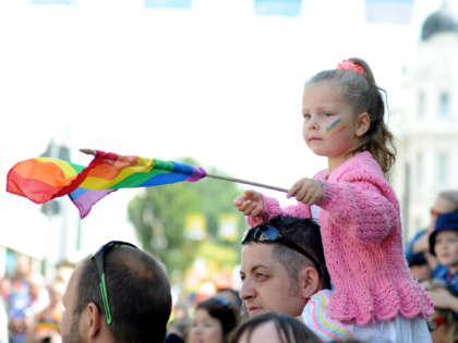 BRIGHTON, ENGLAND - AUGUST 01: A young girl watches the parade during Brighton Pride 2015 on August 1, 2015 in Brighton, England. (Photo by Tabatha Fireman/Getty Images)