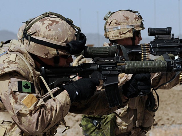 Canadian soldiers with the NATO-led International Security Assistance Force (ISAF) fire their weapons during an exercise at the base of Provincial Reconstruction Team (PRT) in Kandahar Province on March 26, 2008. Eight Afghan civilians were killed and 17 others wounded when a bomb-filled car exploded near a crowded bazaar in …