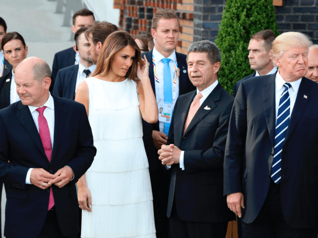 (L-R) Hamburg mayor Olaf Scholz, US First Lady Melania Trump, the husband of the German Chancellor Joachim Sauer and US President Donald Trump stand together after a family photo of the participants of the G20 summit and their spouses prior a concert at the Elbphilharmonie in Hamburg, northern Germany, on …