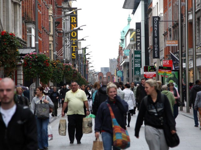 DUBLIN, IRELAND - OCTOBER 15: Shoppers walk down Henry Street on October 15, 2009 in Dubli