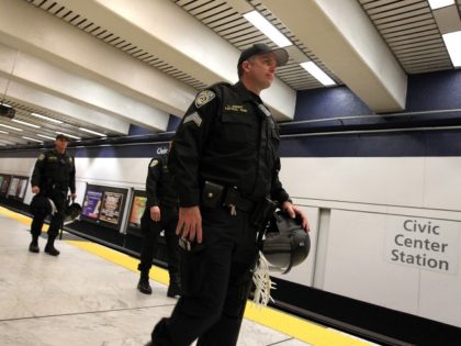 SAN FRANCISCO, CA - AUGUST 15: Bay Area Rapid Transit (BART) police officers patrol the platform at the Civic Center station on August 15, 2011 in San Francisco, California. The hacker group "Anonymous" staged a demonstration at a BART station this evening after BART officials turned off cell phone service …