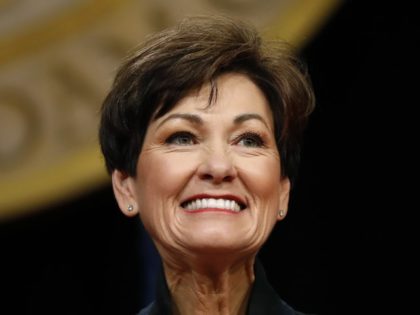 Iowa Gov. Kim Reynolds smiles as she prepares to deliver her inaugural address, Friday, Jan. 18, 2019, in Des Moines, Iowa.