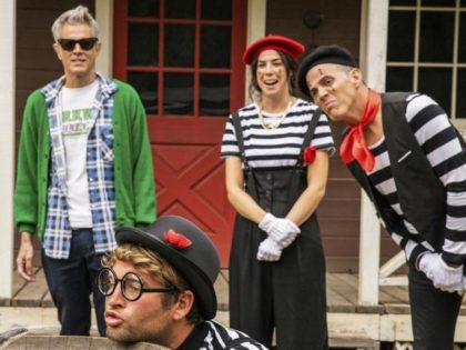 This image released by Paramount Pictures shows, from left, Johnny Knoxville, Sean "Poopies" McInerny, Rachel Wolfson and Steve-O in a scene from "Jackass Forever." (Sean Cliver/Paramount Pictures via AP)