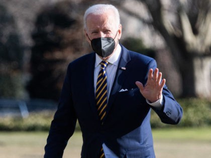 US President Joe Biden walks across the South Lawn after arriving on Marine One at the White House in Washington, DC, February 10, 2022, following a trip to Virginia to speak about lowering healthcare costs. (Photo by Saul Loeb/AFP via Getty Images)