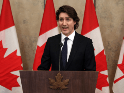 Canada's Prime Minister Justin Trudeau speaks with reporters during a news conference on Parliament Hill February 11, 2022 in Ottawa, Canada. - Canadian Prime Minister Justin Trudeau said Friday an occupation of the capital Ottawa and trucker-led blockades of vital trade links to the United States over Covid rules must …