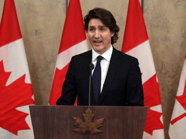 Canada's Prime Minister Justin Trudeau speaks with reporters during a news conference on Parliament Hill February 11, 2022 in Ottawa, Canada. - Canadian Prime Minister Justin Trudeau said Friday an occupation of the capital Ottawa and trucker-led blockades of vital trade links to the United States over Covid rules must …