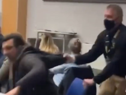 An upstate New York father-of-two was dragged away from a school board meeting for not wearing a mask. (Screenshot/ROC for Educational Freedom Facebook Page)
