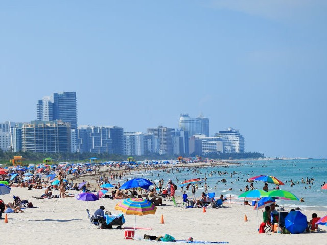 Beachgoers take advantage of the opening of South Beach on June 10, 2020 in Miami Beach, Florida. Miami-Dade county and the City of Miami opened their beaches today as the area eases restrictions put in place to contain COVID-19. (Photo by Cliff Hawkins/Getty Images)
