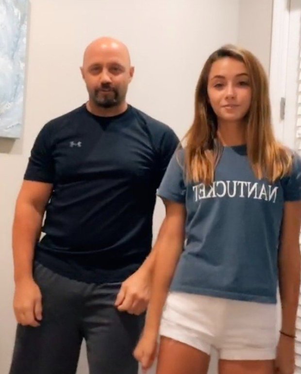 Ava Majury, 14, pictured alongside her father Rob, 51, for one of the teen's TikToksCredit: TikTok