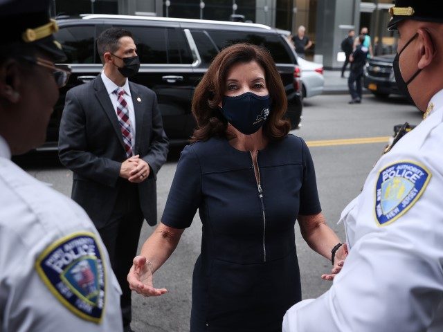 NEW YORK, NEW YORK - SEPTEMBER 08: New York Gov. Kathy Hochul (C) is greeted by Port Authority Police as she arrives to lay flowers to commemorate the 20th anniversary of the September 11 terror attack at the 9/11 Memorial and Museum on September 8, 2021, in New York City. …