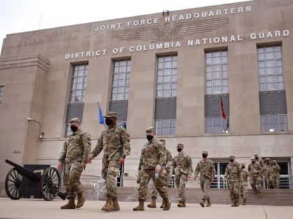 WASHINGTON, DC - MAY 24: National Guard troops make their way to buses as they leave the Armory after ending their mission of providing security to the U.S. Capitol on May 24, 2021 in Washington, DC. The troops are returning to their home states after a four-month deployment to the …