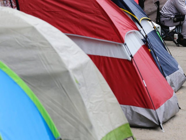People hoping to become carpenters apprentices use tents while waiting in line in New York