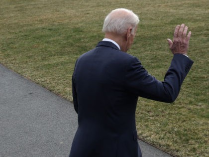 U.S. President Joe Biden waves as he walks towards Marine One prior to a departure for Cle