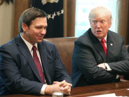 WASHINGTON, DC - DECEMBER 13: Florida Governor-elect Ron DeSantis (R) sits next to U.S. President Donald Trump during a meeting with Governors-elect in the Cabinet Room at the White House on December 13, 2018, in Washington, DC.