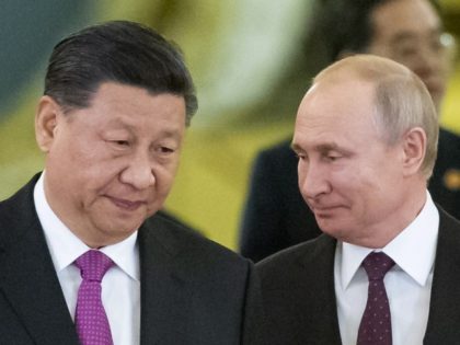 FILE - Chinese President Xi Jinping, center left, and Russian President Vladimir Putin, center right, enter a hall for talks in the Kremlin in Moscow, Russia, June 5, 2019. Amid the soaring tensions over Ukraine, President Vladimir Putin is heading to Beijing on a trip intended to help strengthen Russia's …