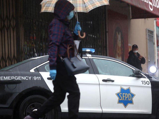 A San Francisco police vehicle outside on a street corner in Chinatown on March 18, 2021,