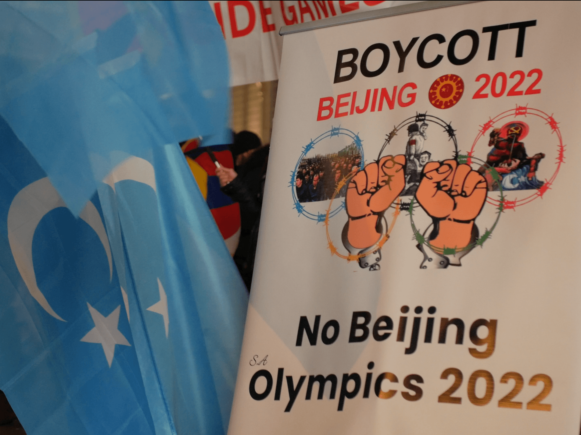 An activist holds a placard at a protest in London calling for a boycott of the Beijing Olympics, February 3rd, 2022. Kurt Zindulka, Breitbart News