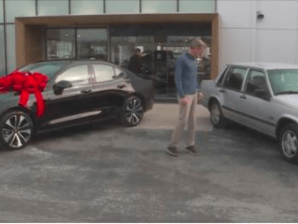 Jim O'Shea of St. Louis County, Missouri, has been rewarded with a brand new car from West County Volvo and Volvo Cars USA after driving his 30-year-old Volvo one million miles. He stands between his old and new Volvos.