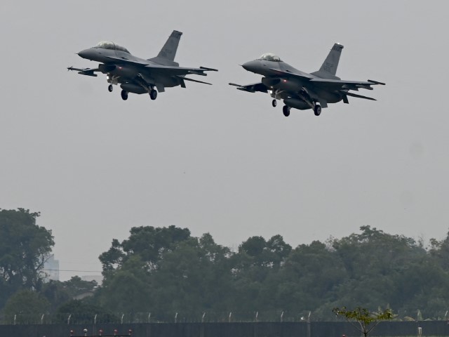 Two armed US-made F-16V fighters fly over an air force base in Chiayi, southern Taiwan on January 5, 2022.
