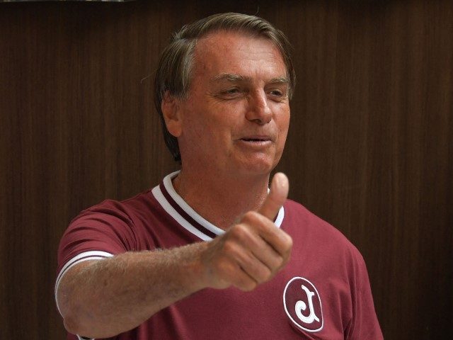 TOPSHOT - Brazil's President Jair Bolsonaro gestures during a press conference at the Vila