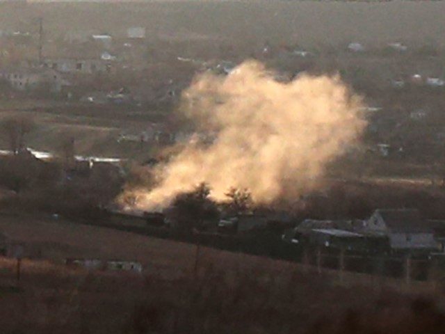 TOPSHOT - A photograph taken on February 19, 2022, shows smoke rising from an explosion after a shelling in Novohnativka village, Donetsk region, not far from position of Ukrainian Military Forces on the front line with Russia-backed separatists. - OSCE monitors recorded more than 1,500 violations of the truce supposedly …