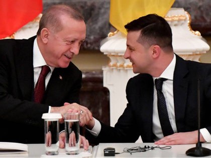 Ukrainian President Volodymyr Zelensky and his Turkish counterpart Recep Tayyip Erdogan shake hands during a joint press conference following their meeting in Kiev on February 3, 2020. (Photo by Sergei SUPINSKY / AFP) (Photo by SERGEI SUPINSKY/AFP via Getty Images)