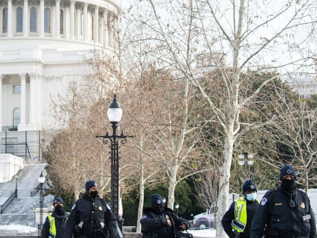 US Capitol Police patrol outside the US Capitol in Washington, DC, January 6, 2022, on the first anniversary of the attack on the US Capitol by supporters of then US President Donald Trump. - Thousands of supporters of then-president Donald Trump stormed the Capitol on January 6, 2021, in a …