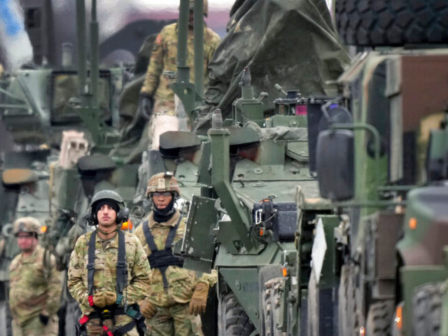 Soldiers of the 2nd Cavalry Regiment line up vehicles at the military airfield in Vilseck, Germany, Wednesday, Feb. 9, 2022 as they prepare for the regiment's movement to Romania loading of Stryker combat vehicles for their deployment to support NATO allies and demonstrate U.S. commitment to NATO Article V. The …