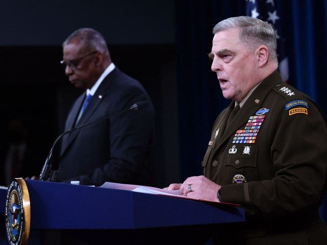 Chairman of the Joint Chiefs of Staff General Mark Milley (R), with Defense Secretary Lloyd Austin, speaks at a press conference in the Pentagon on January 28, 2022, in Washington, DC. - Milley warned Friday that the destruction and human cost of a full-scale incursion by Russian forces into Ukraine …