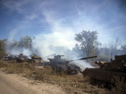 A column of Pro-Russian rebel tanks prepare to move from the front line near Oleksandrivka, Luhansk region, eastern Ukraine, Saturday, Oct. 3, 2015. A summit reviving a European push to bring peace to eastern Ukraine ended Friday with a call for the delay of contentious rebel plans to hold local …