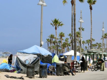 Tents line the Ocean Front Walk on June 30, 2021 in Venice, California, where an initiative began this week offering people in homeless encampments a voluntary path to permanent housing. (Photo by Frederic J. Brown/AFP via Getty Images)