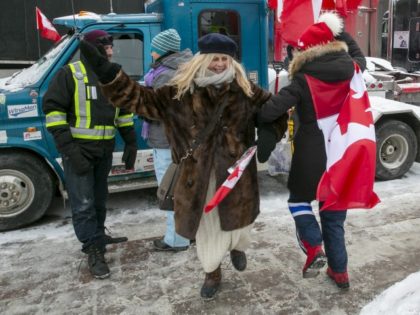 Truck drivers and others protest COVID-19 pandemic restrictions in Ottawa, Ontario, on Saturday, Feb. 12, 2022. A judge has ordered protesters at the Ambassador Bridge over the U.S.-Canadian border to end the 5-day-old blockade that has disrupted the flow of goods between the two countries and forced the auto industry …