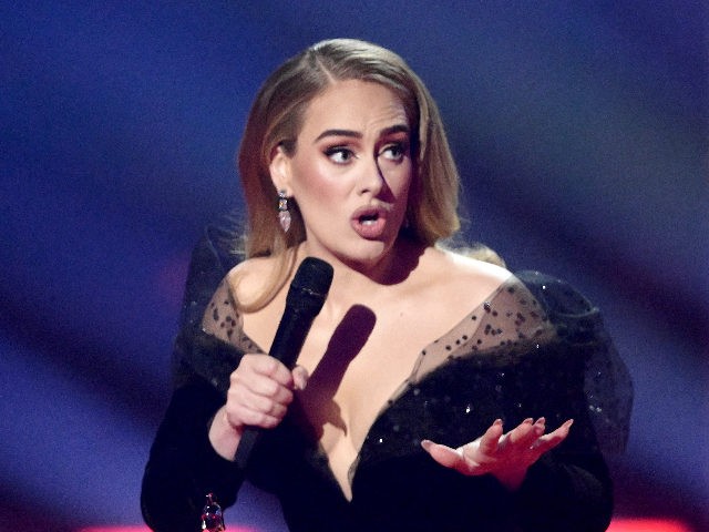 LONDON, ENGLAND - FEBRUARY 08: EDITORIAL USE ONLY Adele receives award for Song of the Year during The BRIT Awards 2022 at The O2 Arena on February 08, 2022 in London, England. (Photo by Gareth Cattermole/Getty Images )