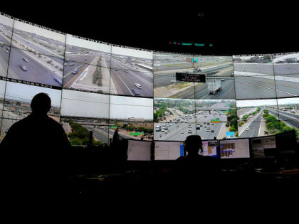 FILE - Arizona Department of Transportation Live Traffic Operations operators monitor over 200 freeway camera's throughout the Phoenix Metro area, Sept. 10, 2015 in Phoenix. Under new federal guidance issued Wednesday, Feb. 2, 2022, states can now tap billions of federal highway dollars for roadway safety programs such as automated …