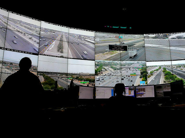 FILE - Arizona Department of Transportation Live Traffic Operations operators monitor over