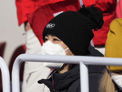 China's Peng Shuai, right, watches the women's freestyle skiing big air finals at the 2022