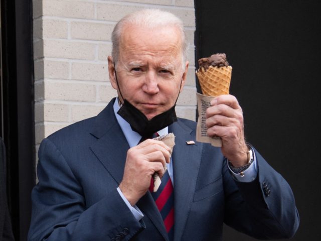 US President Joe Biden carries an ice cream cone as he leaves Jeni's Ice Cream in Washington, DC, on January 25, 2022. (Photo by SAUL LOEB / AFP) (Photo by SAUL LOEB/AFP via Getty Images)