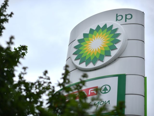 BP logos are seen at a BP petrol and diesel filling station southeast of London on June 15
