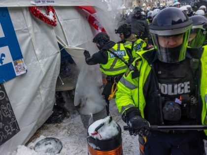 OTTAWA, ONTARIO - FEBRUARY 19: Police face off with demonstrators participating in a protest organized by truck drivers opposing vaccine mandates on Wellington St. on February 19, 2022 in Ottawa, Ontario. The drivers have used vehicles to form a blockade that has blocked several streets near Parliament Hill. Prime Minister …